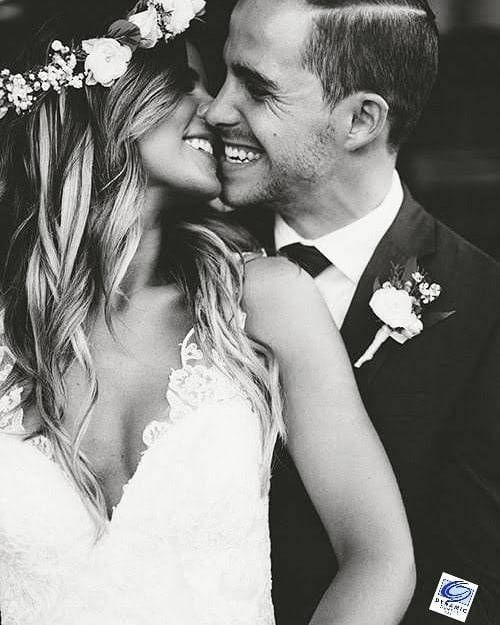 smiling bride and groom kiss